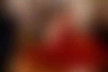 guest in red dress spinning