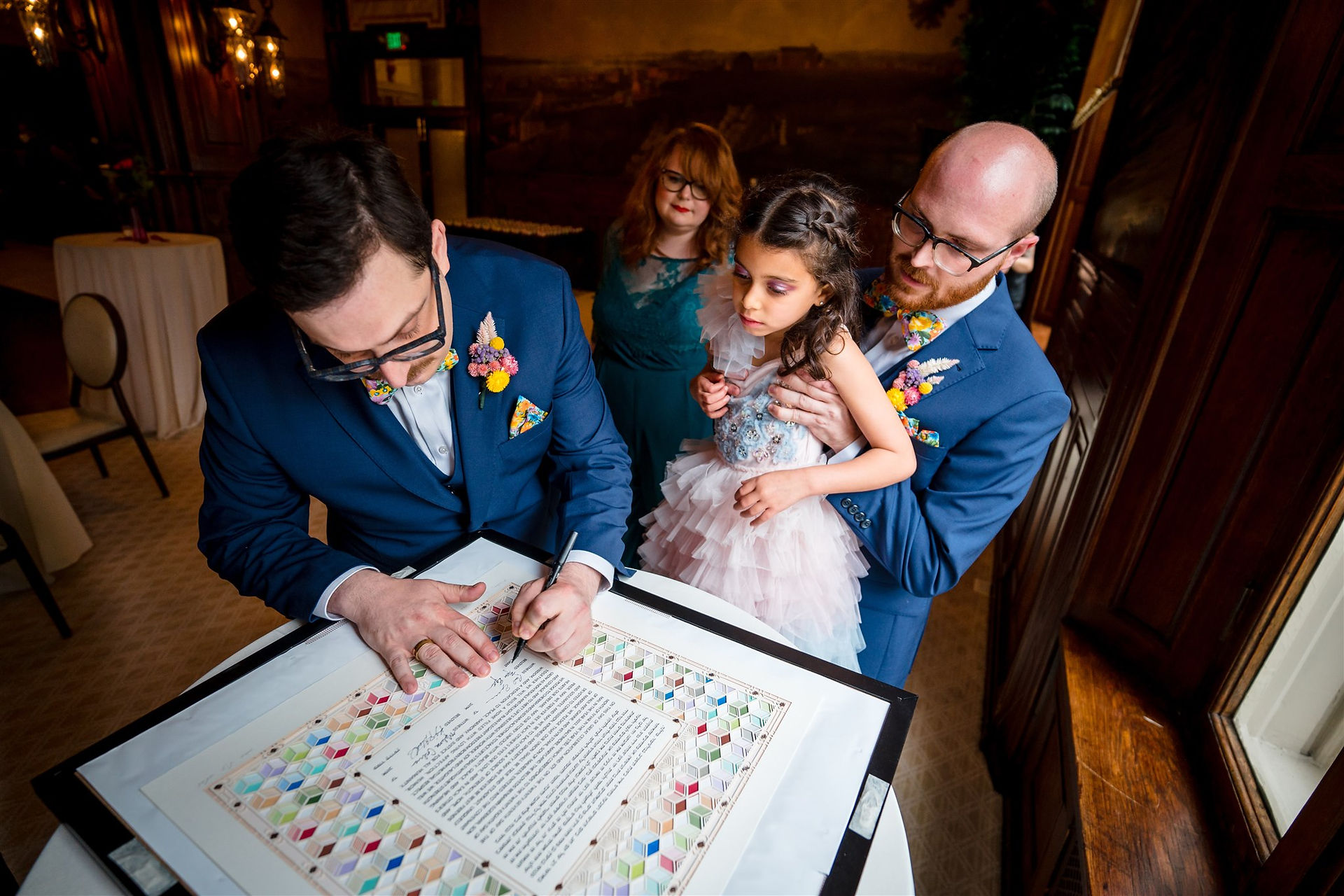 tow grooms signing ketubah 
