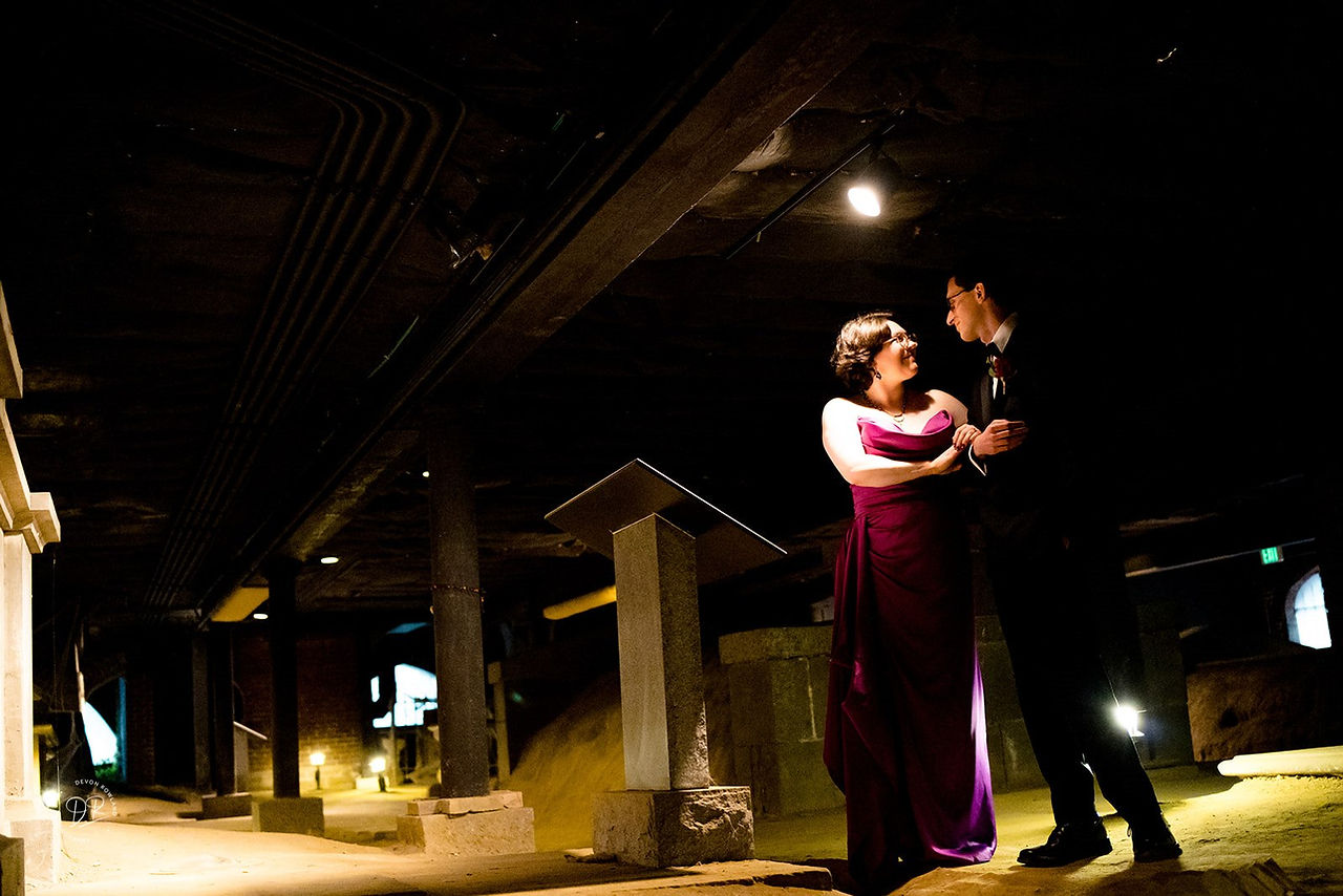 bride and groom dancing in catacomb