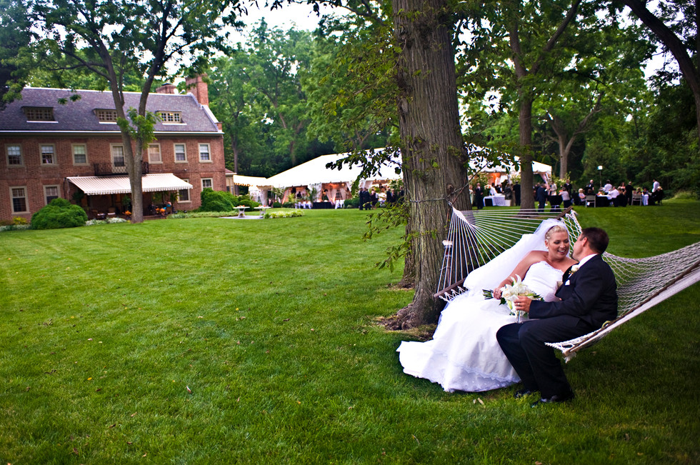 bride and groom in hammock relaxing