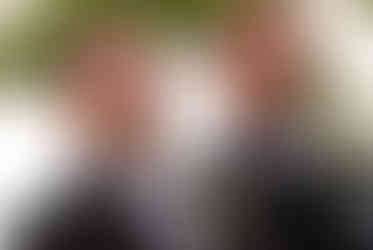 groom smiling as he sees the bride