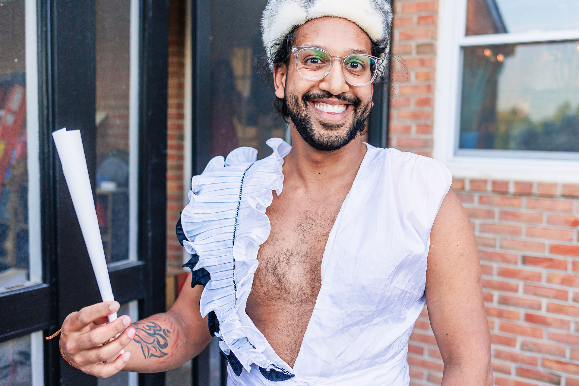 groom in frilly apron making cotton candy
