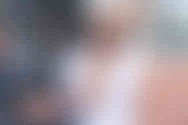 groom in frilly apron making cotton candy