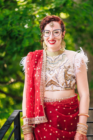 bride in red and gold sari