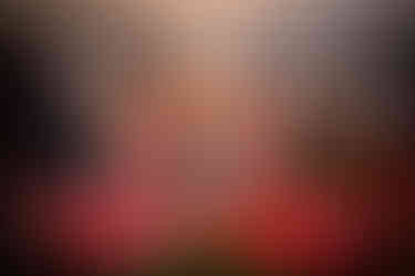 two grooms framed by pink flamingos