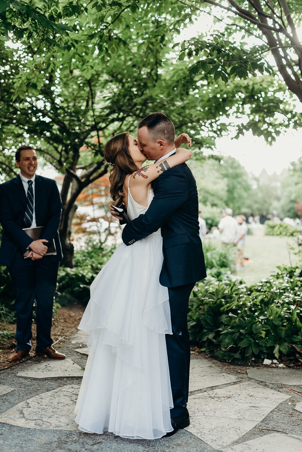 bride and groom kissing after wedding ceremony in Crispus Attucks Park