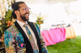 groom in colorful jacket