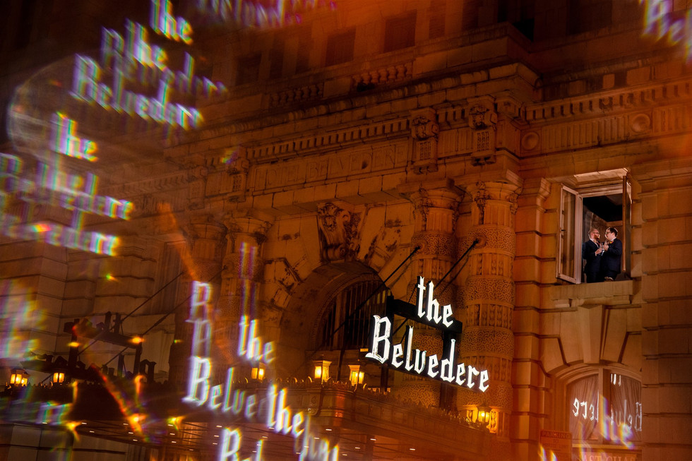 two groom in window frame picture