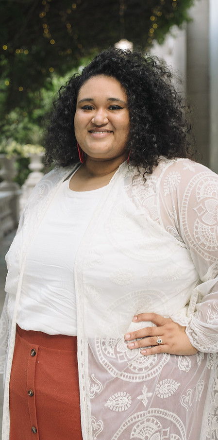 headshot of woman in white shirt
