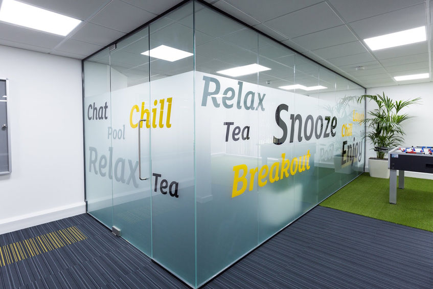 Commercial fit out company delivering bespoke office breakout spaces with branded glass meeting rooms and modern interiors