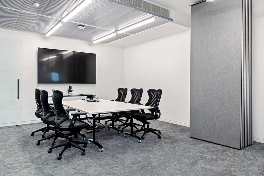 Sustainable office meeting space by Brookhouse with minimalist design and energy-efficient setup
