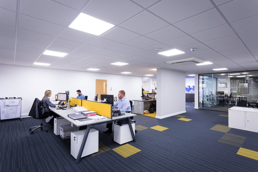 Contemporary office refurbishment by a commercial fit out company featuring open-plan workstations and collaborative spaces