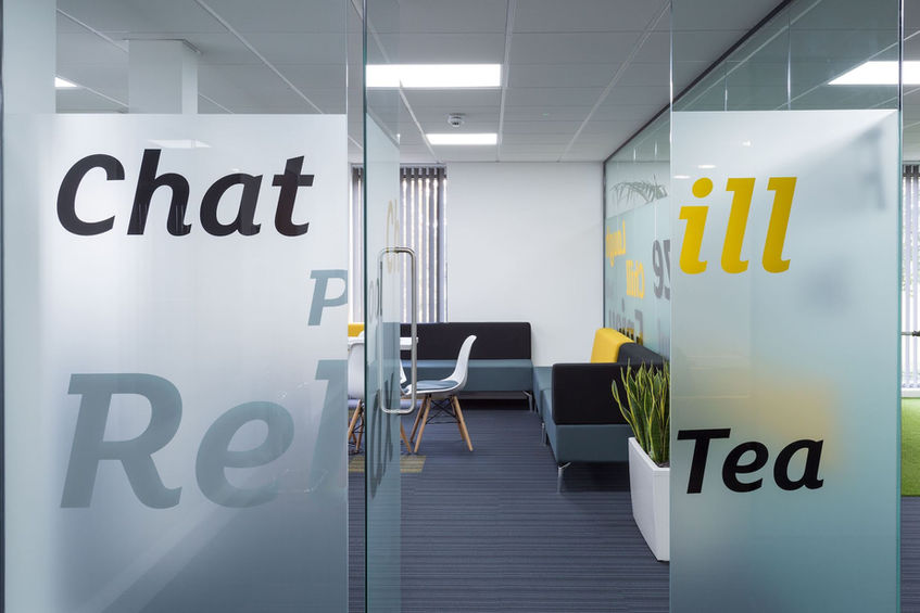 Commercial fit out company creating branded glass office partitions and stylish breakout zones for modern workplaces