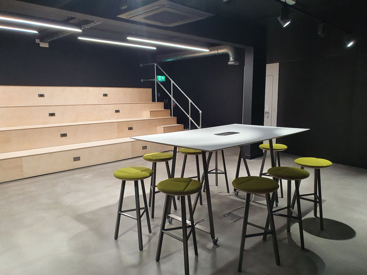 Commercial space planning by Brookhouse with flexible breakout areas and tiered seating design