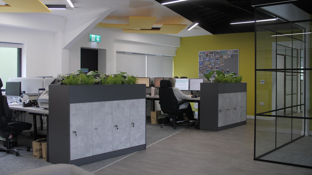 Refurbished office interior by a commercial fit out company featuring modern workstation layouts and contemporary finishes