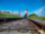 Jackie James stands before the former Tonawanda Coke property. Photo courtesy of Jackie James