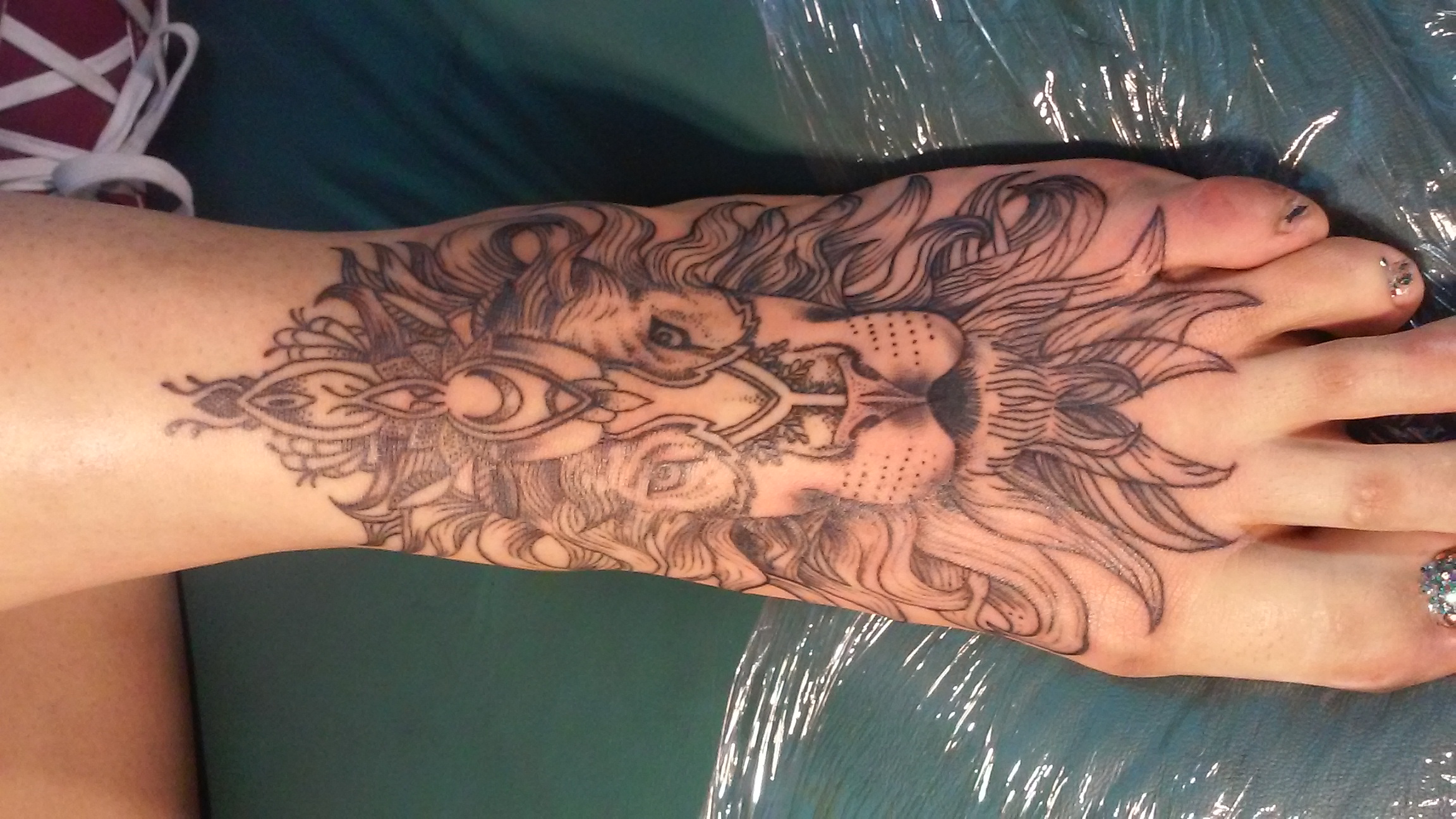 lion foot tattoo