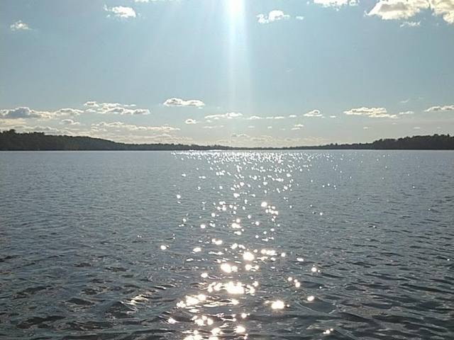Sun sparkling on Otter Tail Lake in summer