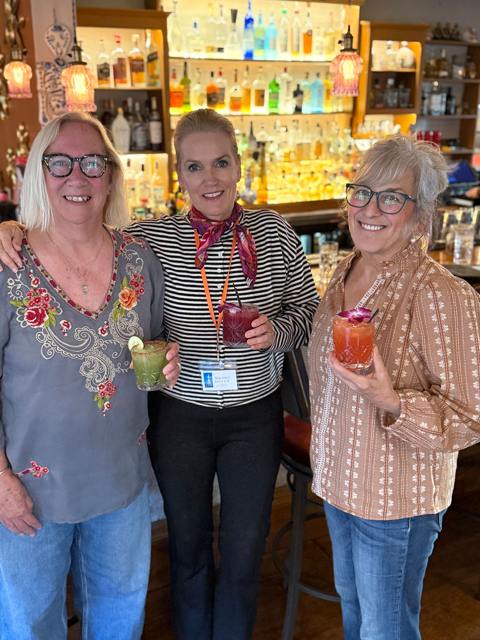 Susan, Manon, and Michele, showing off our cocktails. They were pretty too!