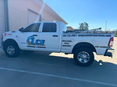 Branded service truck wrap with Long’s Comfort Services logo, contact information, and HVAC service details.