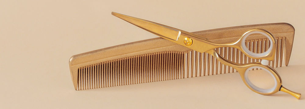Girl with light brown hair posing for the camera showing her long curtain bangs