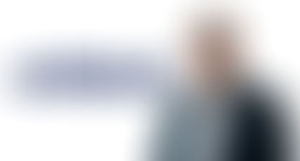 Airbus executive leader in front of Airbus logo – corporate leadership and aviation industry