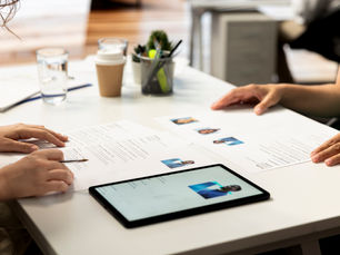 HR managers reviewing resumes and digital profiles during recruitment and hiring process