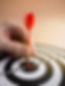 high-angle-hand-putting-dart-bull-s-eye.jpg