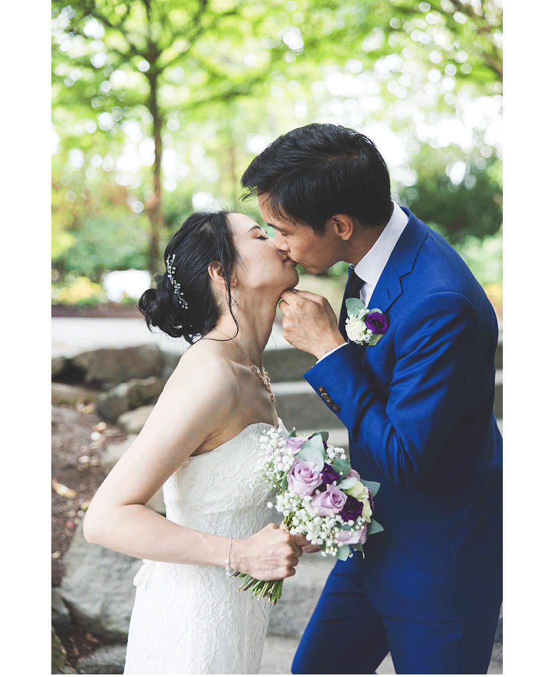 J&L sharing a tender moment by the serene lakeside, the golden sunset casting a warm glow on the couple, expertly captured by a Vancouver wedding photographer