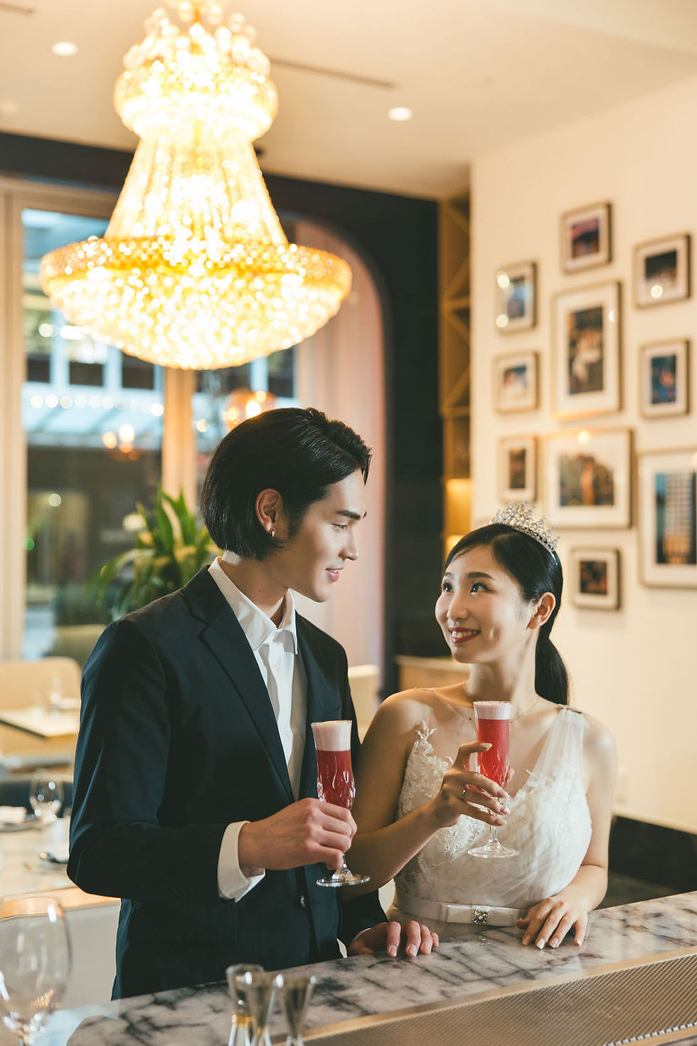 In this captivating image, a loving couple stands against the elegant backdrop of Azur Hotel, their special day artfully frozen in time by our skilled Vancouver wedding photographer, showcasing a perfect blend of romance and expertise in every frame