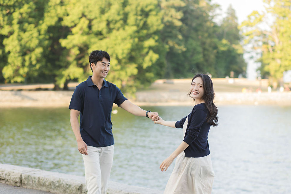 Playful engagement photo shoot in Stanley Park Vancouver along the seawall