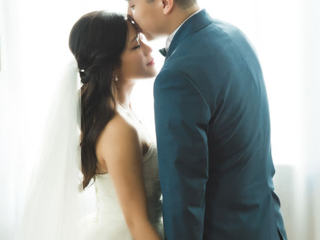 Pre-wedding photoshoot in Vancouver studio with bride and groom posing in soft natural light
