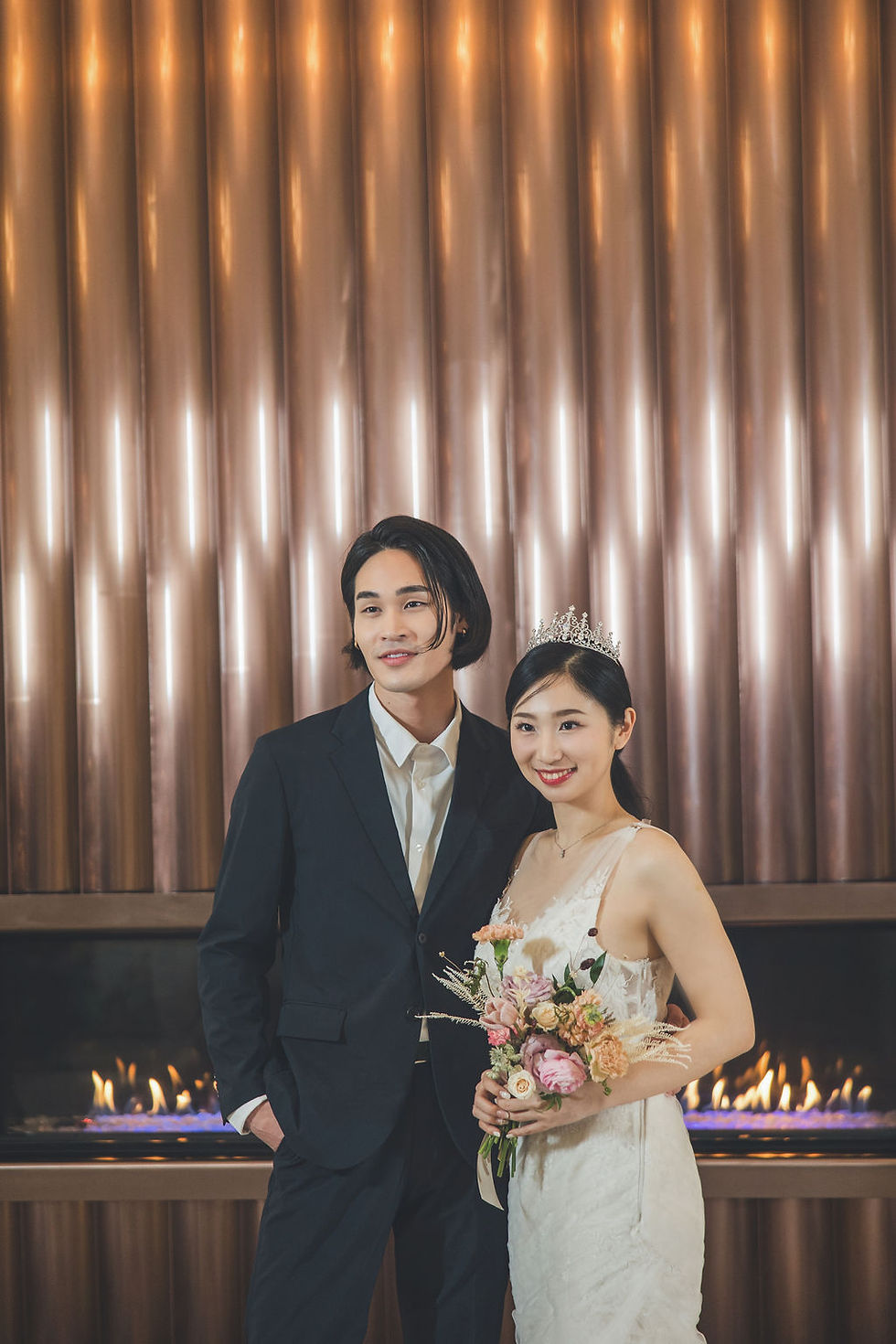 In this captivating image, a loving couple stands against the elegant backdrop of Azur Hotel, their special day artfully frozen in time by our skilled Vancouver wedding photographer, showcasing a perfect blend of romance and expertise in every frame