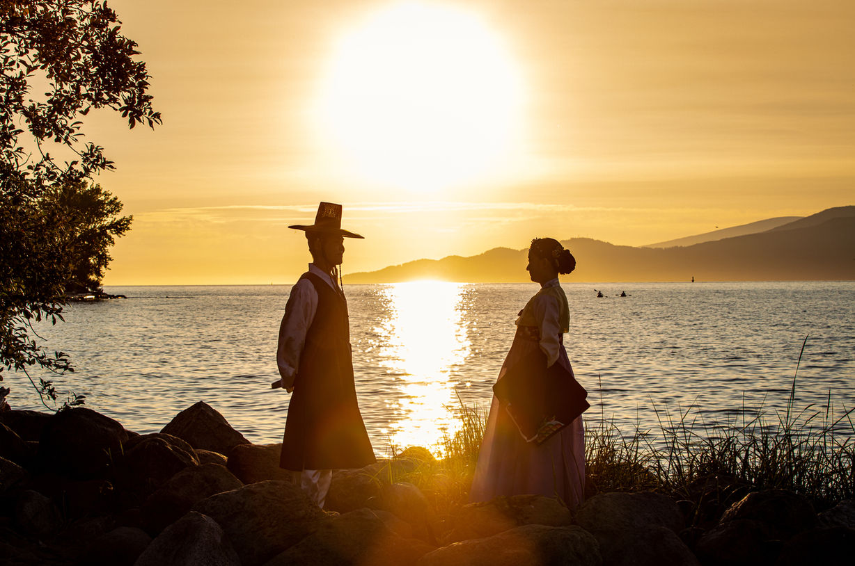 Sunset photo from prewedding photoshoot with Korean traditional dress during the sunset. 