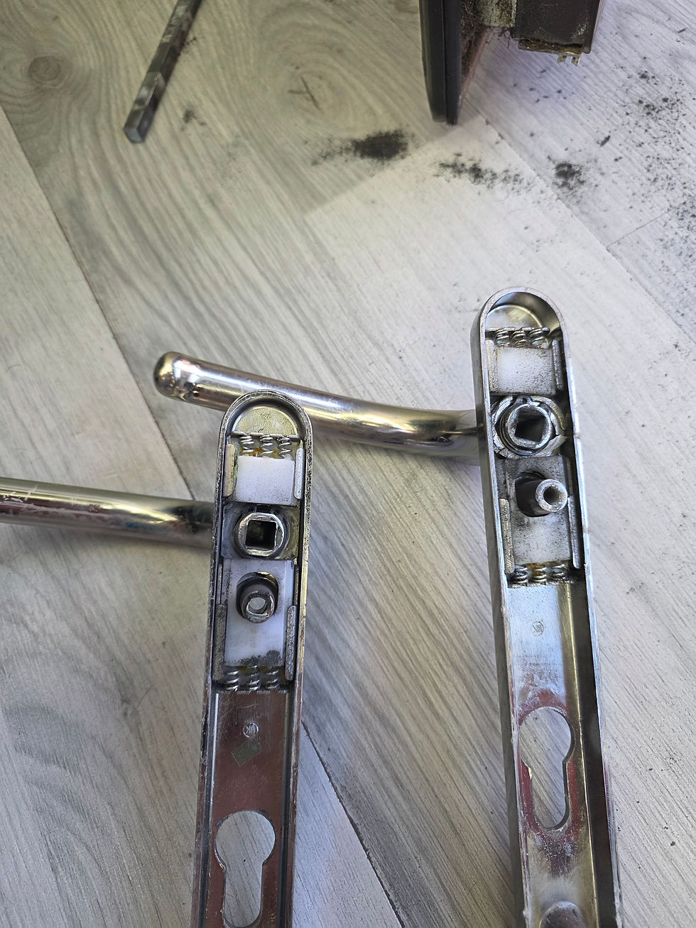 Eye-level view of a locksmith working on a modern electronic lock
