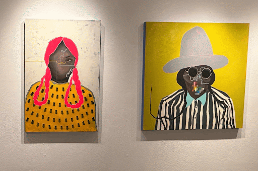 Danielle SeeWalker’s paintings at the “Between Two Worlds” exhibition on Nov. 7. Photo by Rosa Morales-Simmons