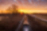 sunset train on tracks