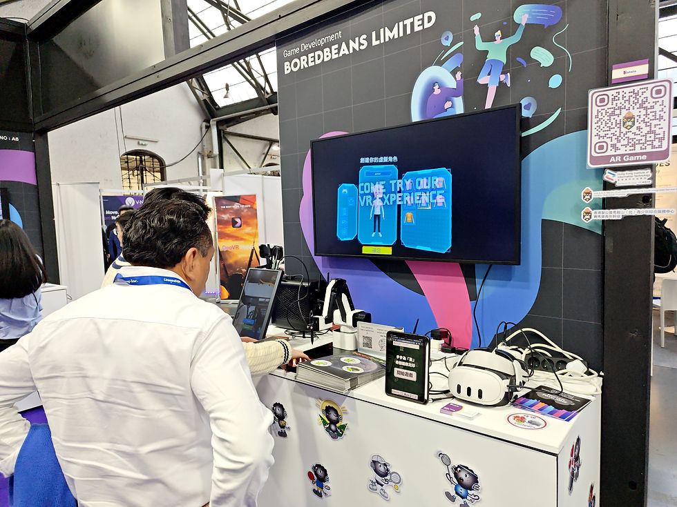 Man in white shirt views a VR booth with "Boredebeans Limited" sign. The screen reads "Come Try Our VR Experience." Bright, techy setting.
