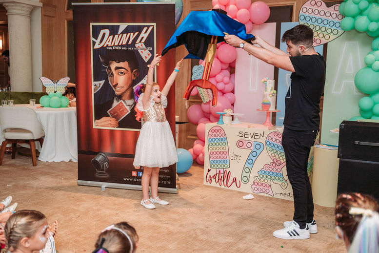 Danny performing a levitating trick with the guest of honor