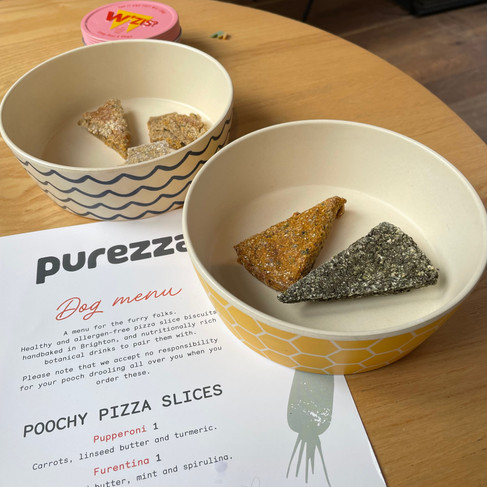 A menu and 2 dog bowls