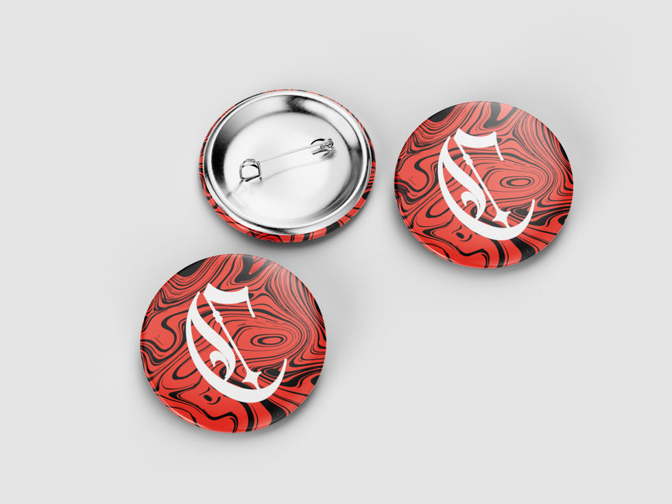 three red and black buttons with the Carla Campbell Creative logo on them