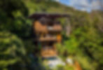 House nestled into the Central American jungle