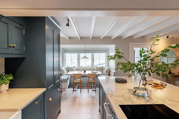 coastal cottage renovation and architectural design by Woodford Architecture in Cornwall. Traditional Cornish cottage restoration combining heritage architecture with modern interior design. Riverside cottage refurbishment in Cornwall featuring bespoke joinery, timber staircase and coastal interiors. Architectural restoration exposing original granite quoins and historic Cornish building features. Coastal home renovation by Woodford Architecture maximising natural light and riverside views. Bespoke interior architecture including custom kitchen, storage beds and handcrafted furniture in Cornwall homes. Contemporary coastal interior design with banquette seating and waterside dining areas. Traditional cottage remodel with rooflights, open timber staircase and bespoke joinery. Heritage home refurbishment preserving original beams and Cornish architectural character. Luxury coastal cottage renovation designed for modern family living in Cornwall. Bespoke kitchen design and interior architecture tailored for entertaining and waterside living. Thoughtful coastal interior styling using natural light, clean palettes and local craftsmanship. Riverside property renovation in Cornwall creating functional spaces and modern storage solutions. Architectural redesign of a historic Cornish cottage blending traditional materials with contemporary design. Woodford Architecture Cornwall specialising in coastal home restoration, refurbishment and bespoke interior design.