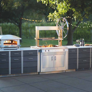 luxury kitchen design Cornwall UK, indoor and outdoor kitchen design trends UK, contemporary kitchen architecture Cornwall homes, outdoor kitchen living and al fresco cooking UK homes, premium kitchen appliances and outdoor grills UK, modern kitchen lifestyle design Cornwall properties, high end kitchen design for luxury homes UK, integrated indoor outdoor living kitchen design, bespoke luxury kitchen spaces Cornwall UK, modern outdoor entertaining kitchens UK homes