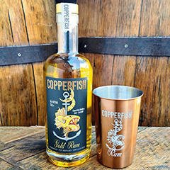 Copperfish Distillery Looe Cornwall craft distillery producing rum, moonshine and Cornish spirits made from scratch. Copperfish Distillery Buller Quay Looe small batch rum distillery creating authentic Cornish spirits from cane to glass. Artisan rum distillery in Looe Cornwall specialising in barrel aged rum crafted using traditional copper stills. Copperfish Gold Rum Cornwall award winning rum matured in oak barrels and recognised by Taste of the West awards. Craft rum producer in Cornwall making spiced rum, pineapple rum and limited edition flavoured spirits. Copperfish Distillery Cornwall producing small batch spirits including black rum, spiced rum and chocolate orange rum. Cornish craft distillery creating rum from fermented cane sugar and molasses using traditional distillation techniques. Looe distillery tours and tastings offering visitors insight into rum fermentation, distillation and barrel ageing. Copperfish Distillery Cornwall producing Moonshine spirits made from local corn, barley and wheat. Cornish Moonshine liqueurs crafted from grain spirit and available in a range of flavoured expressions. Kerbon Cornish bourbon style spirit made from locally grown corn, barley and wheat aged in oak barrels. Looe craft spirits brand celebrating Cornwall’s fishing and mining heritage through the Copperfish name and design. Distillery experience in Looe Cornwall offering tastings, immersive distilling workshops and riverfront views. Cornwall rum distillery producing award winning spirits recognised by Taste of the West awards. Copperfish Distillery Looe championing Cornish craft spirits and small batch distilling with locally inspired flavours.