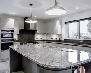 granite, quartz and sintered stone worktops handcrafted by Duke Stone of Cornwall for kitchens and bathrooms. Bespoke stone kitchen worktops designed and installed by stonemasons in Cornwall. Luxury granite kitchen countertops fabricated and fitted for Cornwall homes and new build developments. Quartz worktops and custom stone surfaces created by Duke Stone of Cornwall. Sintered stone kitchen worktops offering durable and heat resistant surfaces for modern kitchens. Natural stone countertops crafted from granite and quartz for bespoke kitchen design in Cornwall. Stone bathroom vanities, flooring and interior stone surfaces supplied by Cornwall stonemasons. Custom cut stone worktops manufactured and installed for luxury homes across Cornwall. Contemporary kitchen design featuring polished granite, quartz and sintered stone surfaces. Traditional stonemasonry craftsmanship producing bespoke kitchen worktops and stone interiors. Natural stone surfaces sourced and fabricated by Duke Stone workshop in Cornwall. High end kitchen countertops combining durability, natural beauty and bespoke fabrication. Luxury interior stone design for kitchens, bathrooms and architectural features in Cornwall homes. Professional stone templating, fabrication and installation services by Duke Stone of Cornwall. Cornish stonemasons specialising in granite, quartz and sintered stone kitchen worktops.