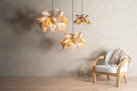 steam bent wood lighting designed in Cornwall by Tom Raffield using traditional craftsmanship and sustainable materials. Sculptural wooden pendant lights handcrafted in Falmouth Cornwall inspired by organic forms and nature. Contemporary wooden lighting and furniture by Tom Raffield made using steam bending techniques. Sustainable home lighting crafted from responsibly sourced timber in Cornwall design studio. Handcrafted wooden pendant lights inspired by seashell shapes and natural curves from the Cornish coast. Luxury wooden lighting design combining modern interiors with natural materials by Tom Raffield. Artisan steam bent wood furniture and lighting designed and made in Cornwall. Nature inspired interior design pieces including sculptural lampshades and wooden lighting fixtures. Contemporary British design studio Tom Raffield producing sustainable handcrafted lighting and furniture. Organic wooden lighting installations bringing natural textures and movement into modern interiors. Eco friendly interior design products using steam bent ash wood crafted in Cornwall. Designer wooden pendant lighting for contemporary homes and hospitality interiors. Sustainable lighting and furniture made in the UK using traditional wood bending techniques. Sculptural wooden lamps and statement lighting inspired by nature and Cornish landscapes. Handcrafted luxury wooden lighting collections from Tom Raffield studio in Falmouth Cornwall.