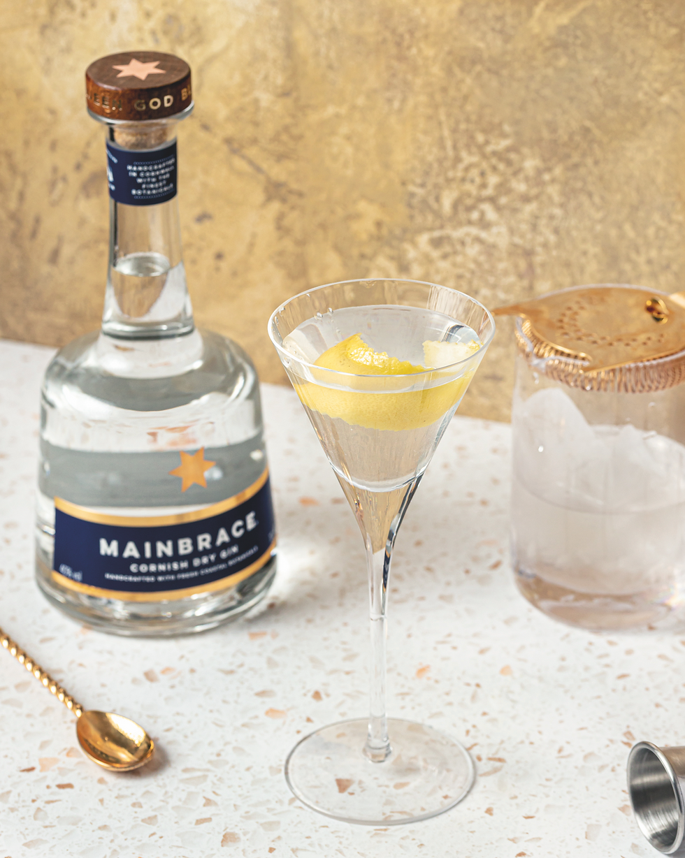 Mainbrace Rum Cornish spirits brand producing premium rum and Cornish dry gin inspired by maritime heritage and coastal ingredients. Mainbrace Premium Golden Rum crafted by the Haigh family blending Caribbean rums from Guyana and Martinique with a nautical brand identity rooted in British naval tradition. Cornish rum brand celebrating the phrase “splice the mainbrace” with artisan rum blending and coastal storytelling. Mainbrace Navy Strength Rum premium small batch spirit inspired by Royal Navy rum traditions. Cornish Dry Gin from Mainbrace featuring coastal botanicals including seaweed, citrus lemon and lime reflecting Cornwall’s marine environment. Craft spirits brand in Cornwall combining Caribbean rum heritage with Cornish coastal identity and maritime culture. Premium Cornish rum and gin brand inspired by sailing, gig rowing and the heritage of Britain’s naval traditions. Artisan rum blending using Demerara rum from Guyana and agricole rum from Martinique creating a balanced golden rum with depth and sweetness. Cornish drinks brand supporting coastal communities and marine conservation through partnerships such as Clean Ocean Sailing. Premium rum cocktails including espresso rumtini, vesper martini and classic gimlet using Mainbrace spirits. British craft rum brand with nautical branding and coastal heritage rooted in Cornwall’s maritime culture. Small batch premium spirits celebrating sea, sailing and coastal lifestyle in Cornwall. Cornish rum and gin perfect for classic cocktails and modern mixology inspired by the ocean and naval history. Coastal inspired spirits brand blending international rum traditions with Cornish identity and craftsmanship. Mainbrace Rum Cornwall premium craft spirits brand bringing maritime heritage, sea air botanicals and coastal storytelling into modern rum and gin production.