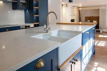 granite, quartz and sintered stone worktops handcrafted by Duke Stone of Cornwall for kitchens and bathrooms. Bespoke stone kitchen worktops designed and installed by stonemasons in Cornwall. Luxury granite kitchen countertops fabricated and fitted for Cornwall homes and new build developments. Quartz worktops and custom stone surfaces created by Duke Stone of Cornwall. Sintered stone kitchen worktops offering durable and heat resistant surfaces for modern kitchens. Natural stone countertops crafted from granite and quartz for bespoke kitchen design in Cornwall. Stone bathroom vanities, flooring and interior stone surfaces supplied by Cornwall stonemasons. Custom cut stone worktops manufactured and installed for luxury homes across Cornwall. Contemporary kitchen design featuring polished granite, quartz and sintered stone surfaces. Traditional stonemasonry craftsmanship producing bespoke kitchen worktops and stone interiors. Natural stone surfaces sourced and fabricated by Duke Stone workshop in Cornwall. High end kitchen countertops combining durability, natural beauty and bespoke fabrication. Luxury interior stone design for kitchens, bathrooms and architectural features in Cornwall homes. Professional stone templating, fabrication and installation services by Duke Stone of Cornwall. Cornish stonemasons specialising in granite, quartz and sintered stone kitchen worktops.