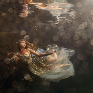Lexi Laine underwater photographer Cornwall fine art photography, Lexi Laine ethereal underwater photography inspired by myth and folklore, Cornwall underwater photography featuring freediving models, Lexi Laine fine art photographer exploring marine environments, Underwater portrait photography Cornwall by Lexi Laine, Fine art underwater photography inspired by baroque painting, Lexi Laine award winning photographer Beautiful Bizarre Art Prize winner, Cornwall artist creating surreal underwater dreamscapes, Freediving photography projects capturing women beneath the water surface, Lexi Laine photography inspired by ocean mythology and marine life, Underwater photography Cornwall and global locations including Mexico cenotes, Lexi Laine Sony UK sponsored photographer documentary Under The Surface, Fine art underwater portraits blending fantasy and reality, Cornwall creative photographer exploring themes of water and vulnerability, Lexi Laine artistic underwater imagery influenced by renaissance lighting